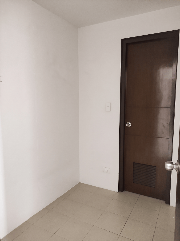 Freshly painted room with wooden door, The Florence McKinley Hill