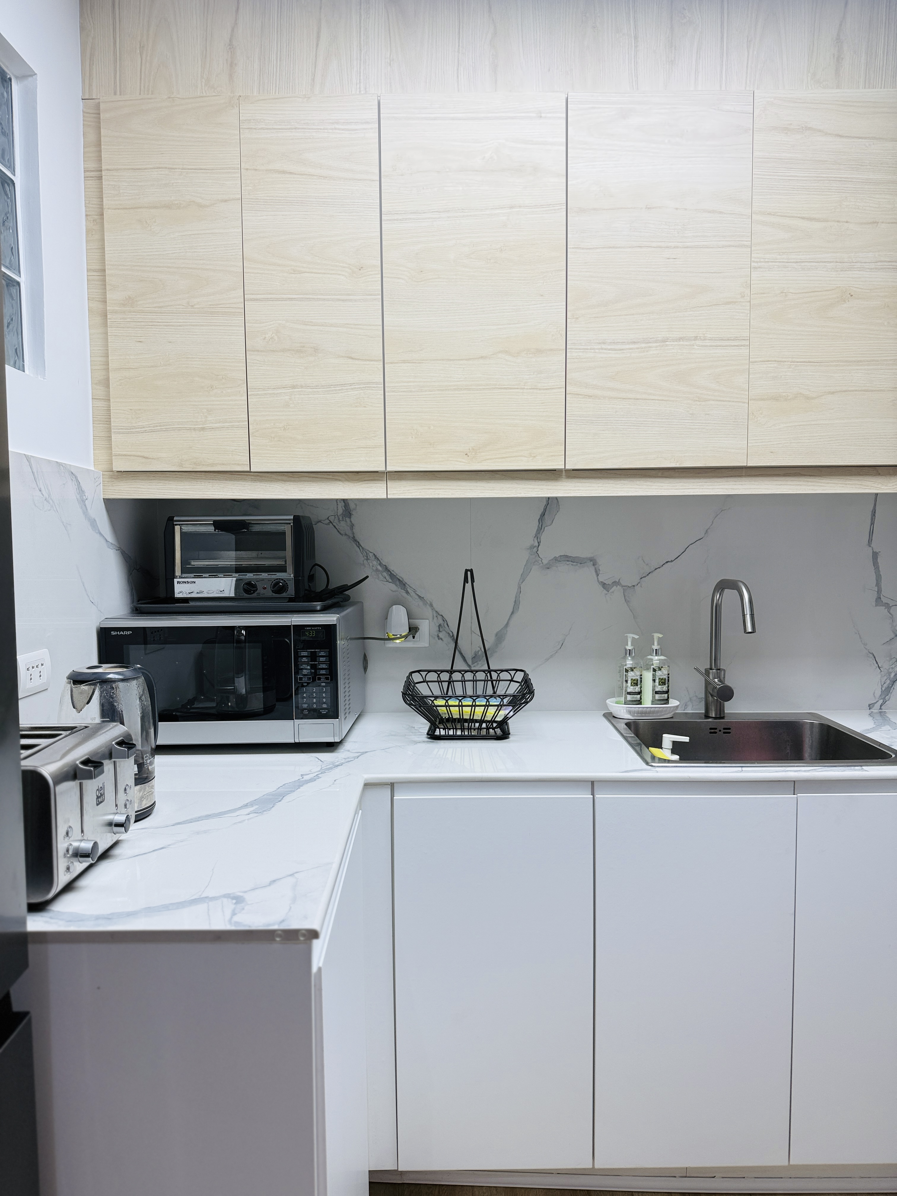 Upgraded kitchen countertops and cabinetry at Goldland Tower