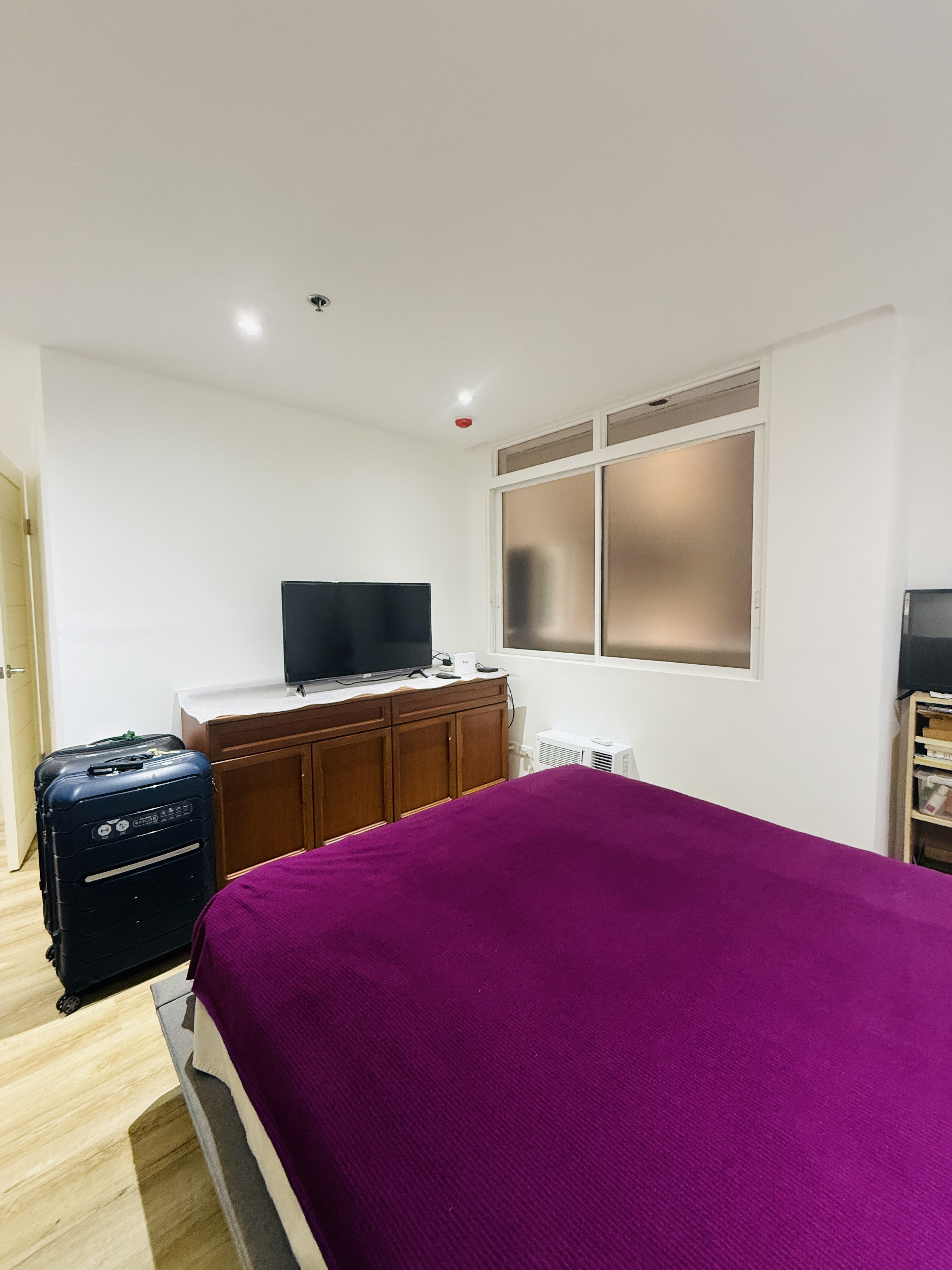 Master bedroom in the remodeled 2-bedroom unit at Goldland Tower