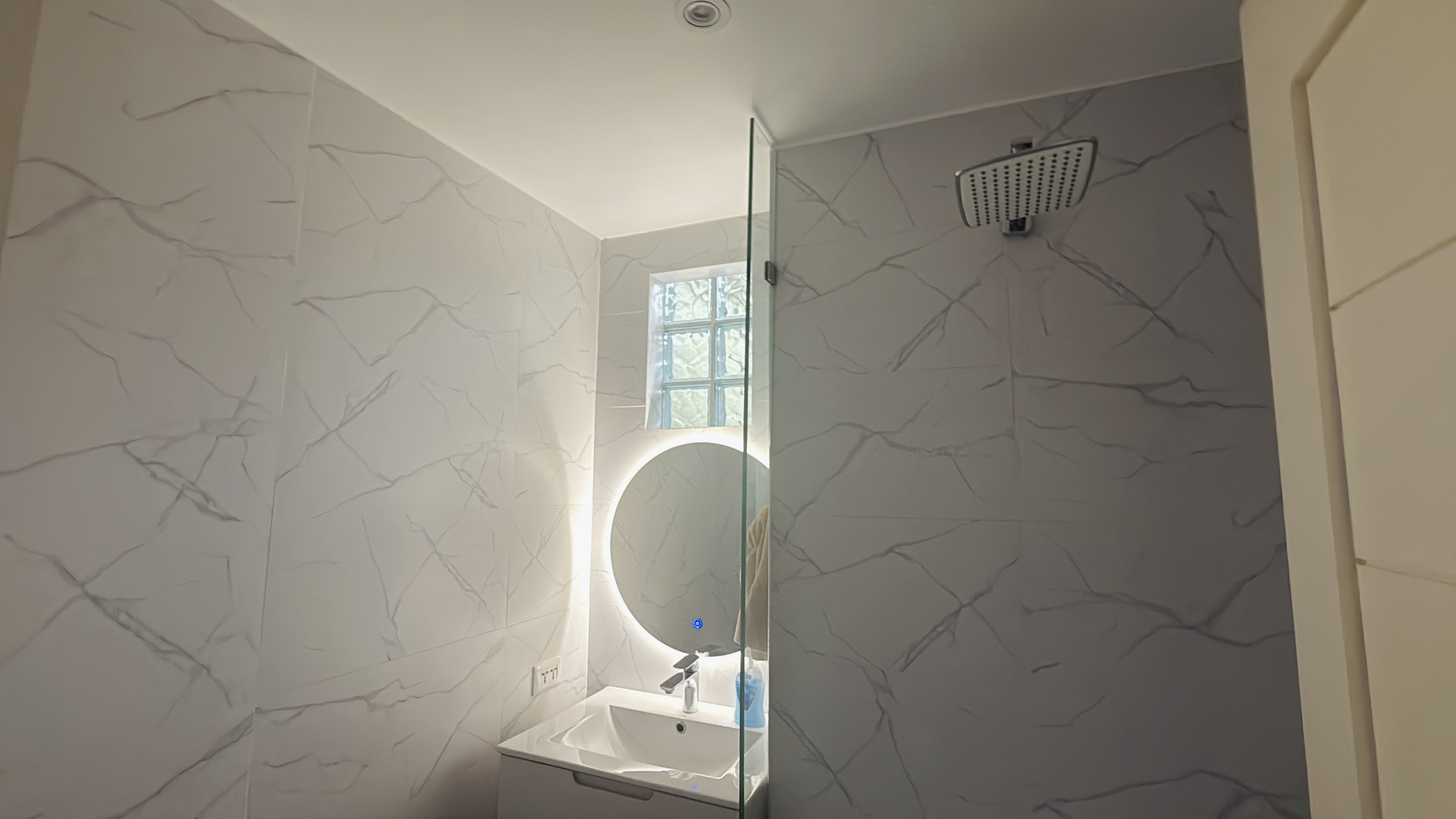 Contemporary powder room at Goldland Tower